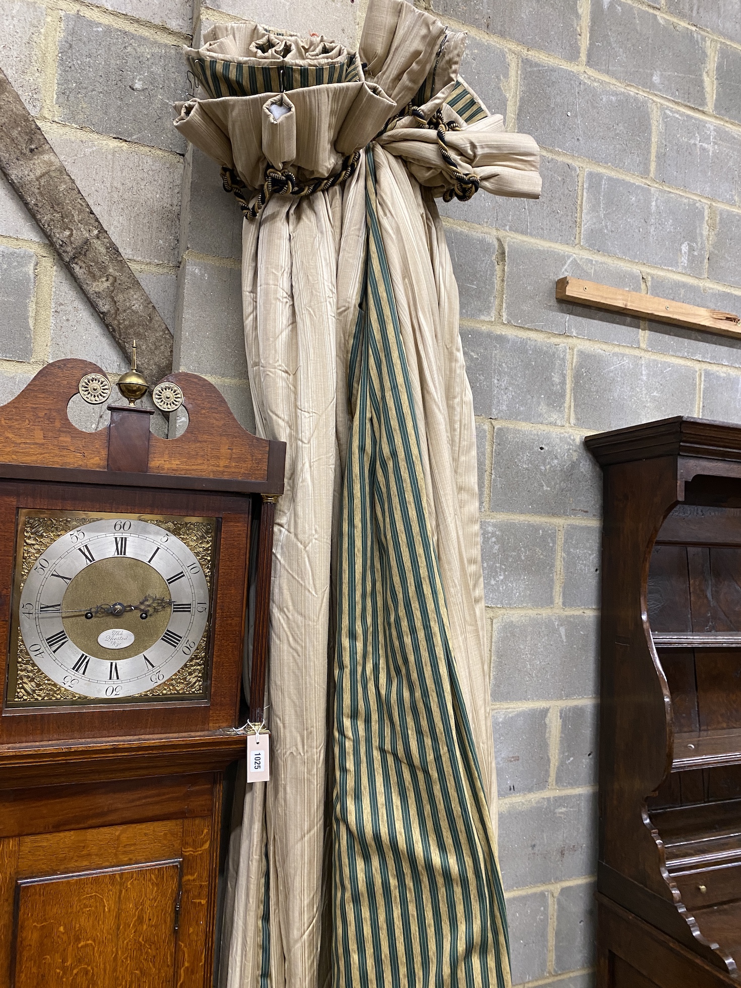 A pair of gold striped curtains with green / gold striped linings, approximate widths 150cm top , 300cm floor, 240cm drop.